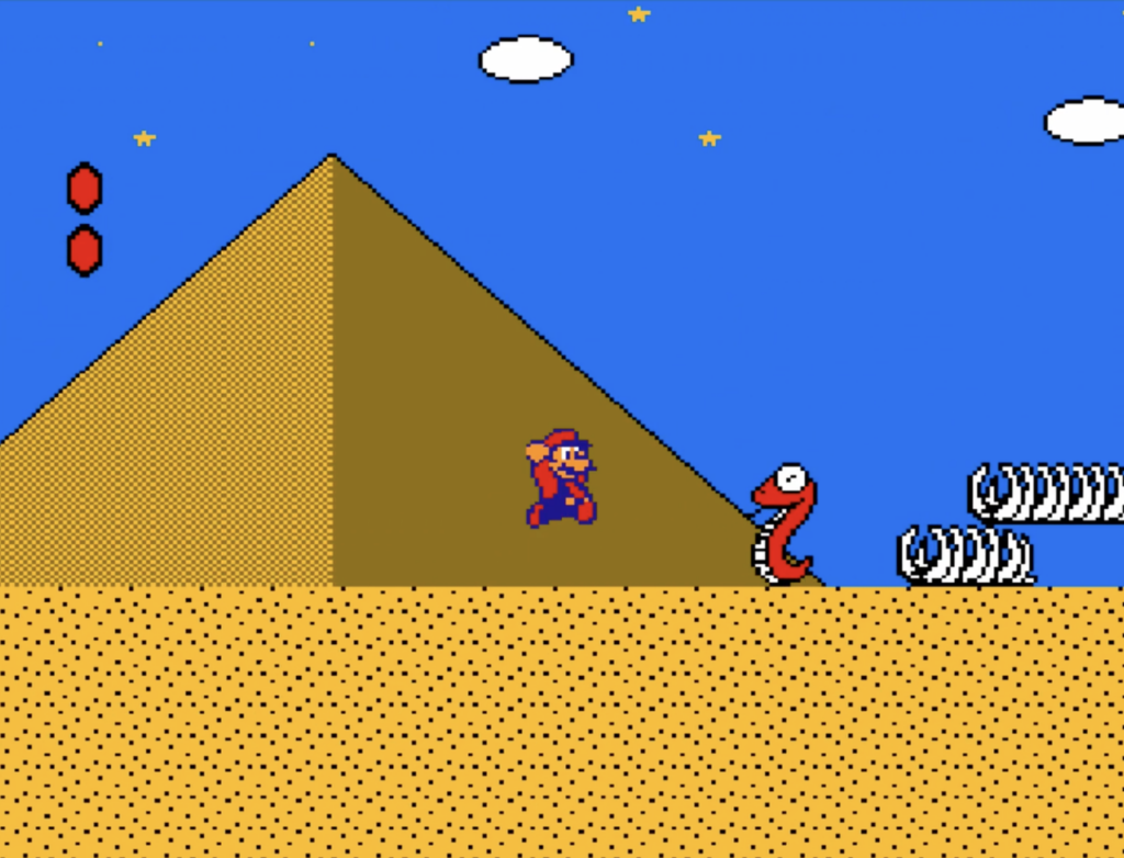 Mario in the desert facing a snake enemy with pyramids in the background.