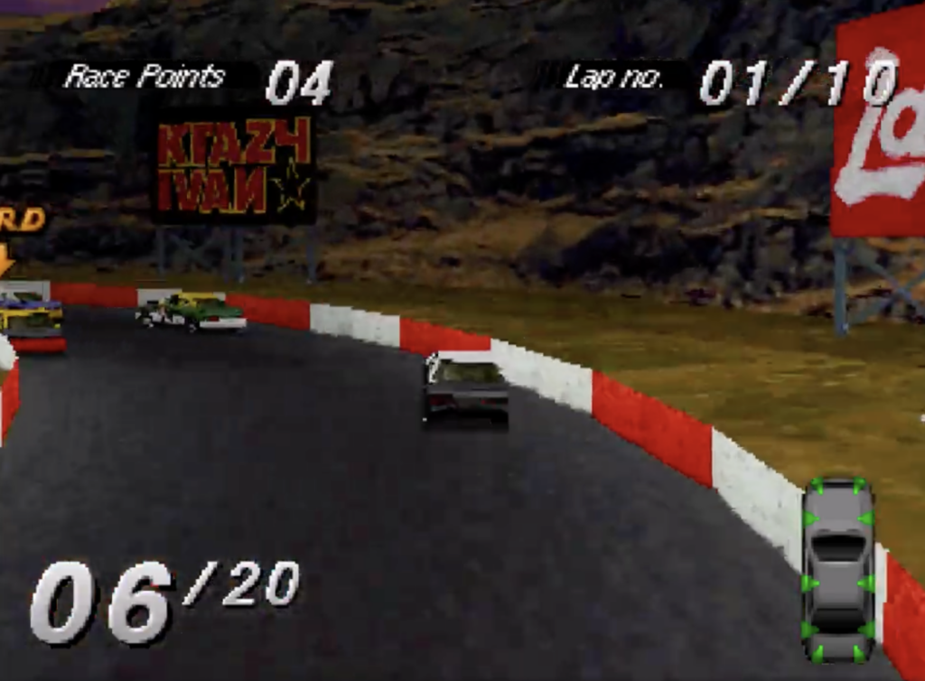 Destruction Derby car is riding up along side the wall.